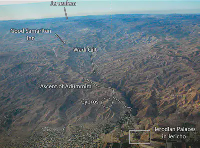 A picture containing text, mountain, outdoor, valley Description automatically generated